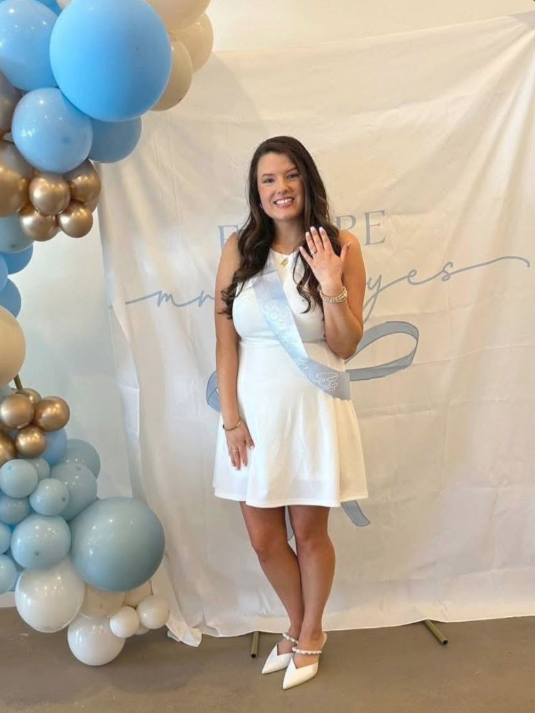 Sister Sunless client showing her engagement ring at a celebration